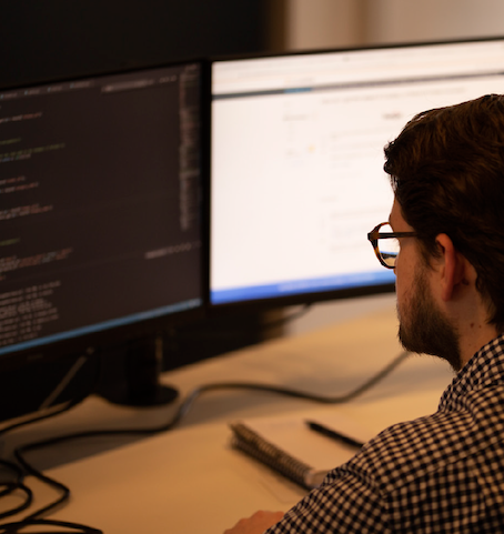 ADSP employee at computer screen